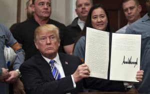 President Trump surrounded by invited tariff supporters