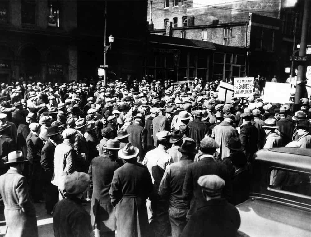 A demonstration of hundreds of unemployed in Kansas City, MO during the Great Depression. FDR's New Deal policies of mandating elevated wages and supplementary benefits favored those already employed at the expense of the unemployed. The policies forced millions of Americans to endure the misery of unemployment for the entire 1930s.